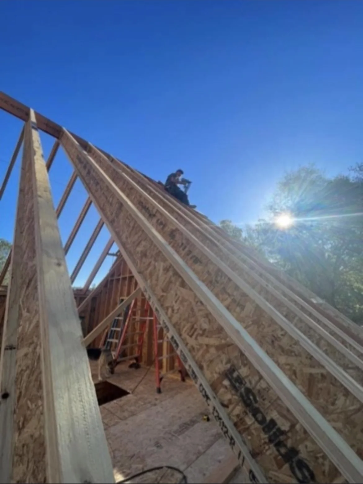 Wood roof framing being constructed